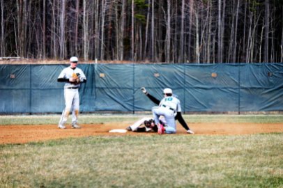 Charlie Dillon attempts to avoid the tag on a slide (Photo by: Paul Fritschner)