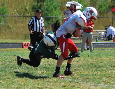 Michael Nguyen tackles an opposing player (Photo by: Laurie Young)
