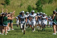 The Wolves celebrate after their first win of the season over The Potomac School (Photo by: Laurie Young)